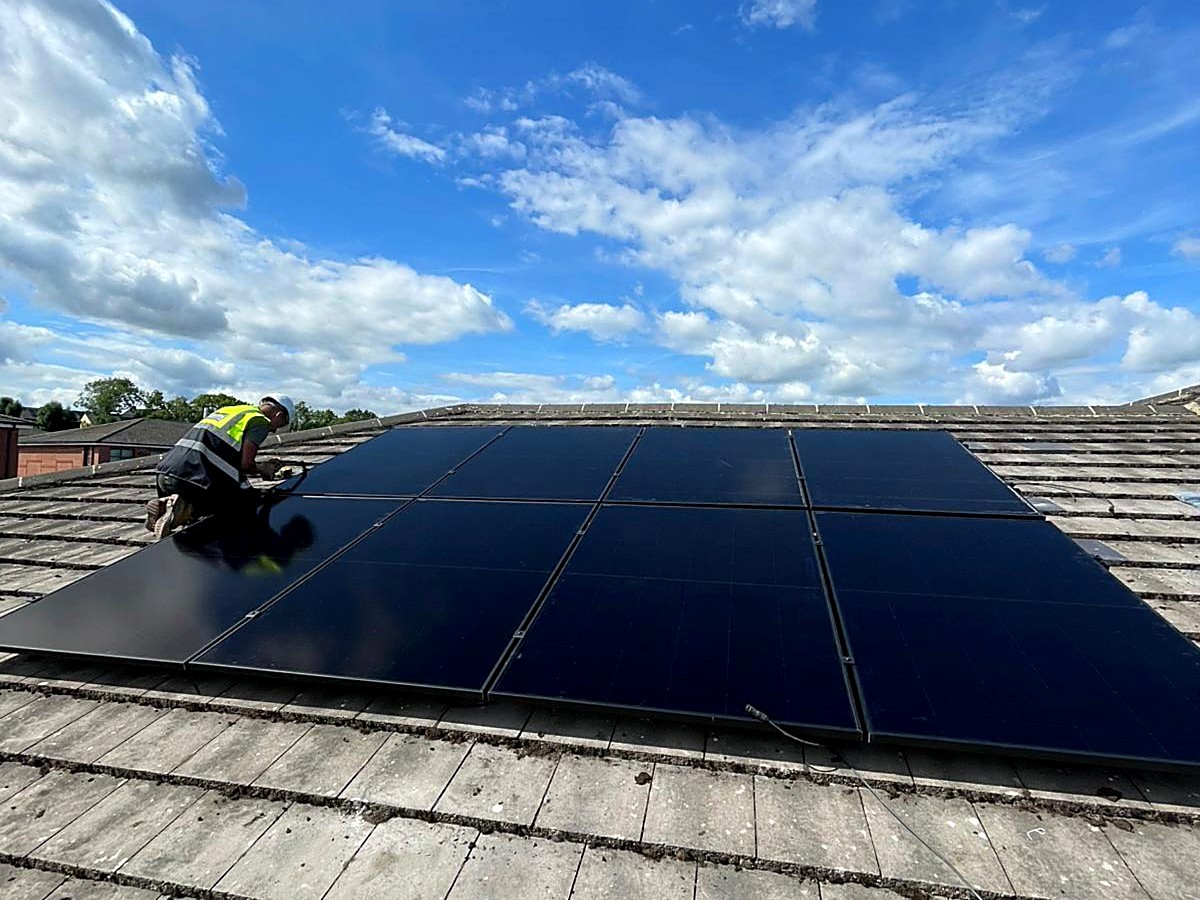 MySolar247 installer fitting solar panels on a roof
